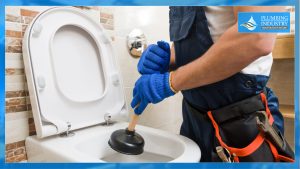 Plumber holding a Toilet plunger