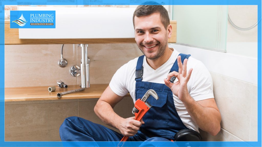 Plumber holding a pipe wrench